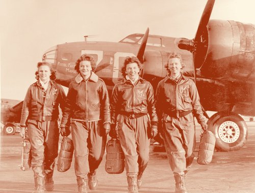 Four WASP pilots walking away from a B-17 bomber, about 1944.