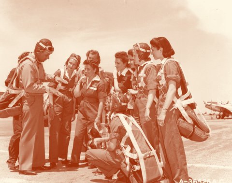 WASP trainees gathered around their instructor, 1944.