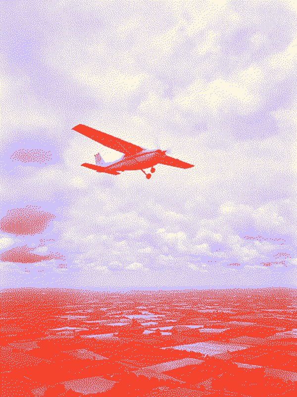 Small single-engine plane flying over clouds.